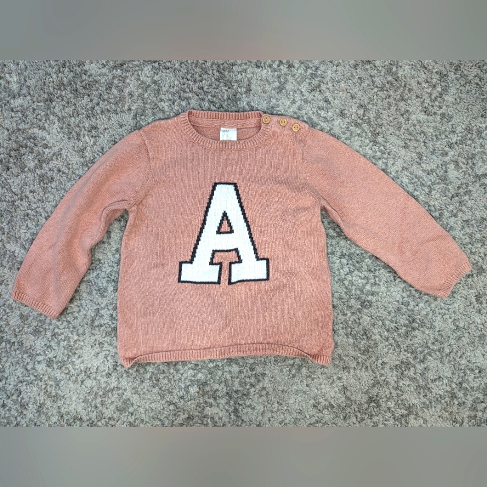 2/$18. H&M pink shirt. Letter "A" size 12-18 months.